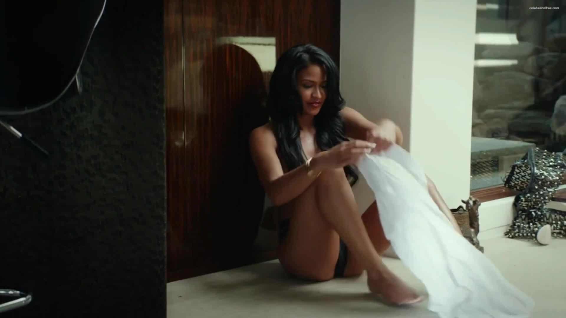 naked cassie ventura putting on a white blouse