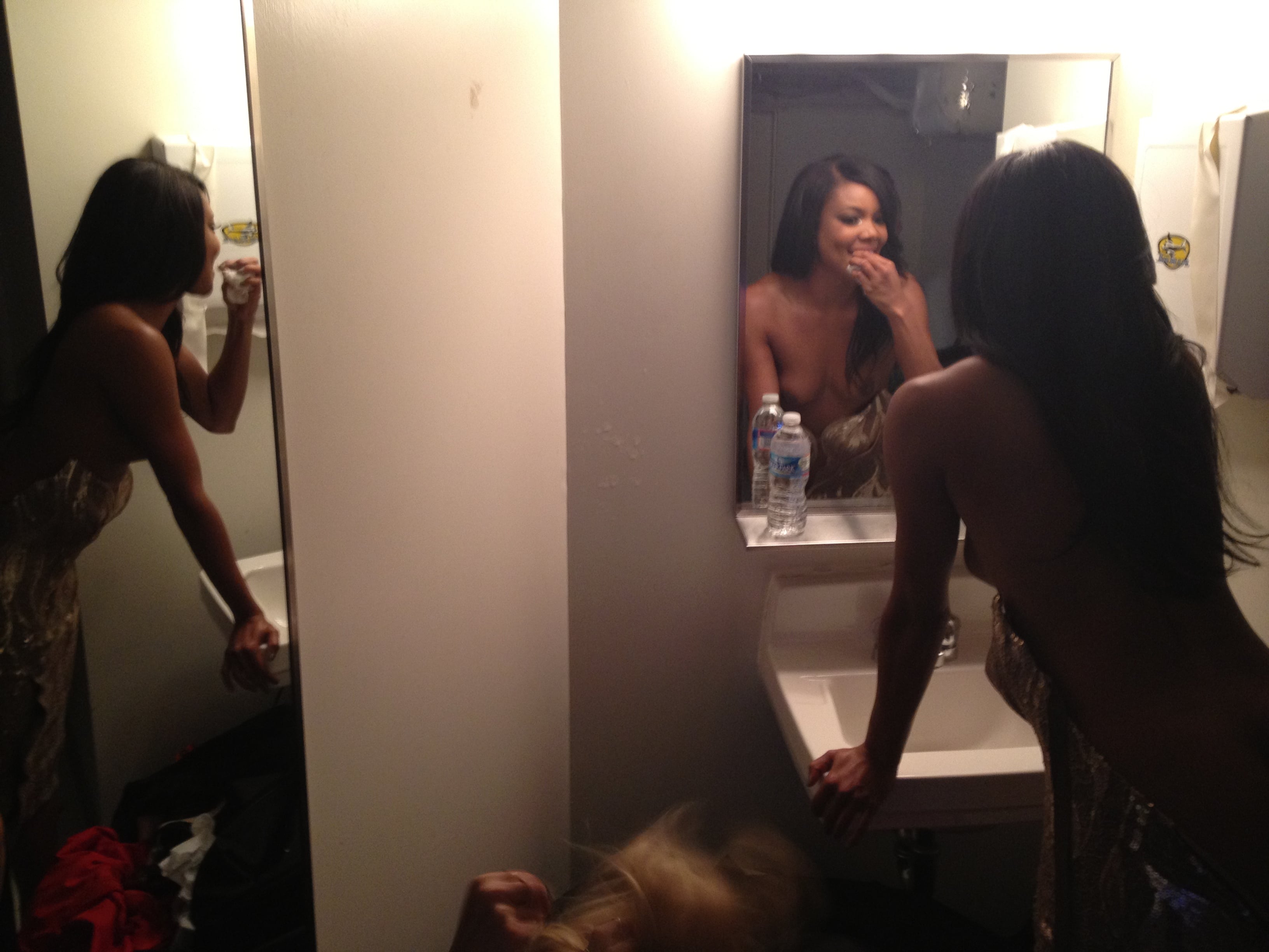 hacked pic of gabrielle union with her ass sticking out and tits revealed in her bathroom while brushing her teeth