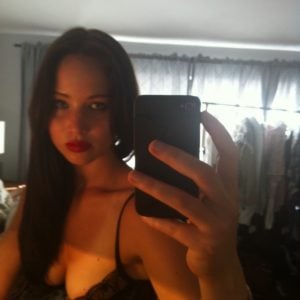 Jlaw takes a pic of herself with dark hair and black bra