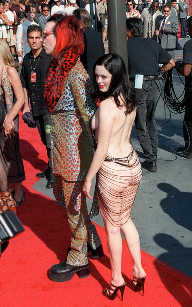 The scandalous Rose McGowan in a stringy dress showing her entire ass