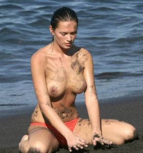 polish model joanna krupa topless on beach playing in sand