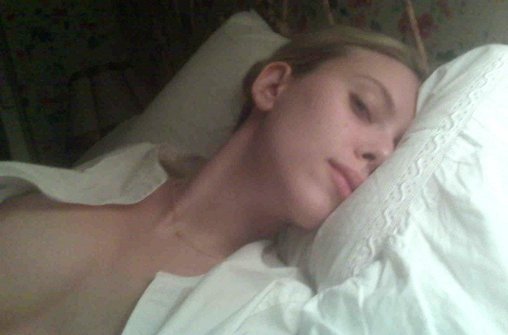 The seductive Scarlett Johansson showing some cleavage in bed