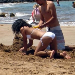 Vanessa Hudgens making a sandcastle with zac efron