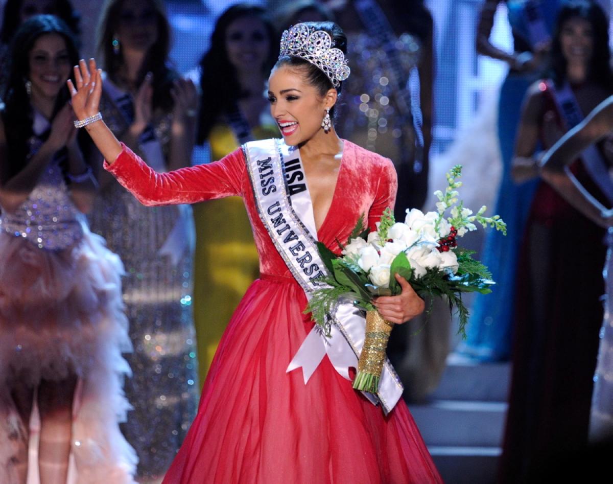 Beauty queen Olivia Culpo in Miss Universe competition with a red gown on