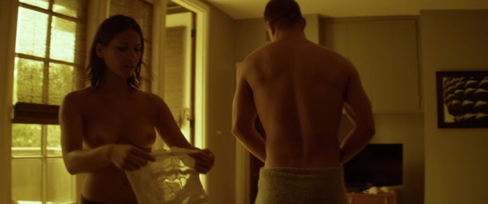 Channing Tatum shirtless and topless Olivia Munn putting on a shirt in movie scene
