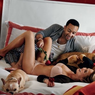 John Legend in bed with wife Chrissy Teigen and their french bull dog