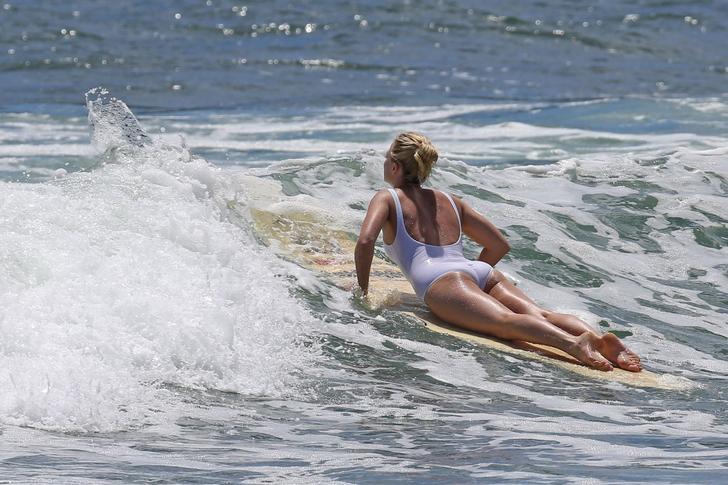 Margot Robbie butt showing while surfing
