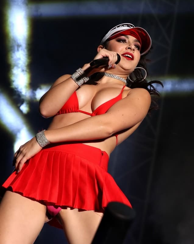 Upskirt photo of Charlie XCX in red skirt during concert