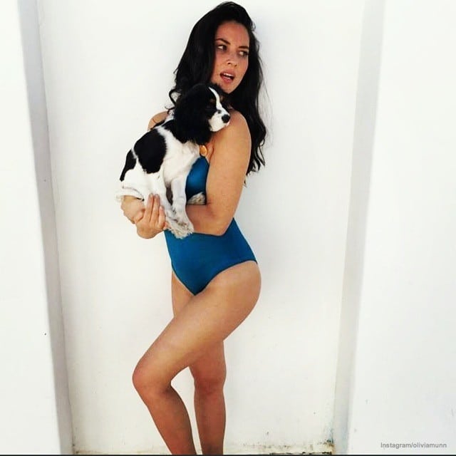 instagram photo of brunette beauty olivia munn in swimsuit holding her puppy