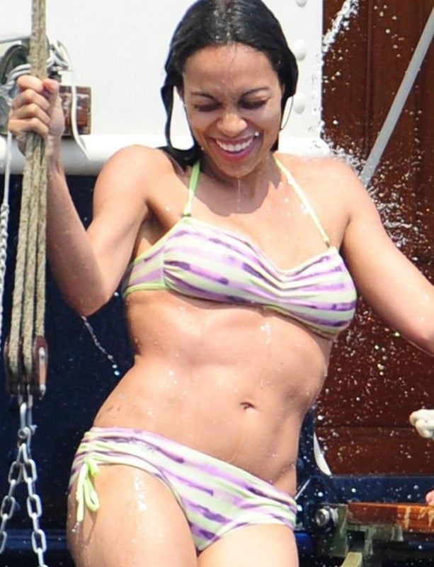Rosario Dawson wet in bikini smiling and showing off her abs
