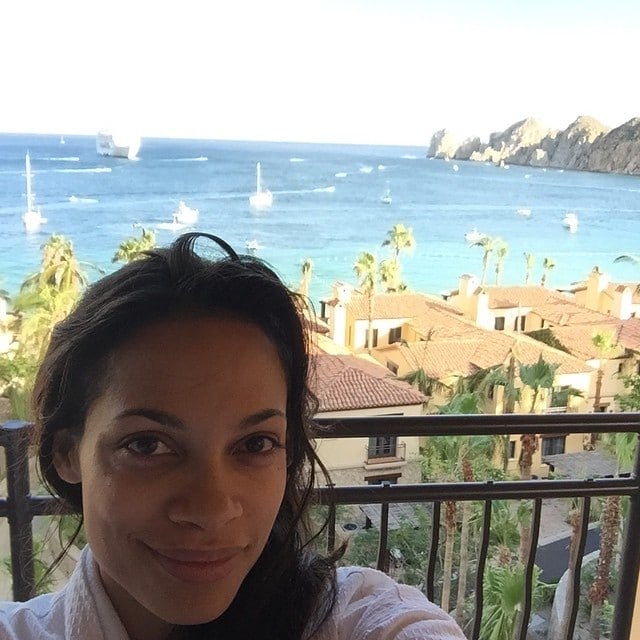 rosorio dawson takes a selfie with ocaean view behind her and wearing no make up