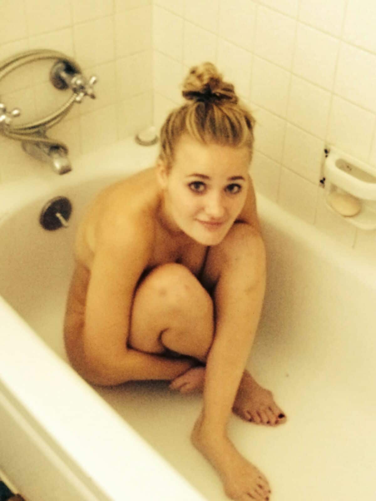 AJ Michalka completely naked in a bathtub