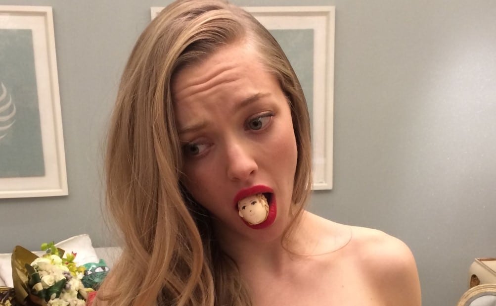 Amanda Seyfried with doll head in her mouth