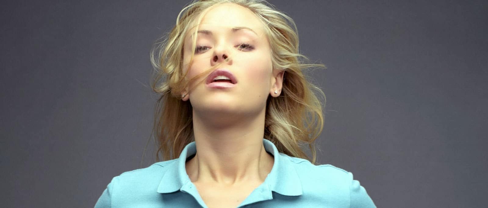 Kristanna Loken in a blue shirt withe her hair blowing