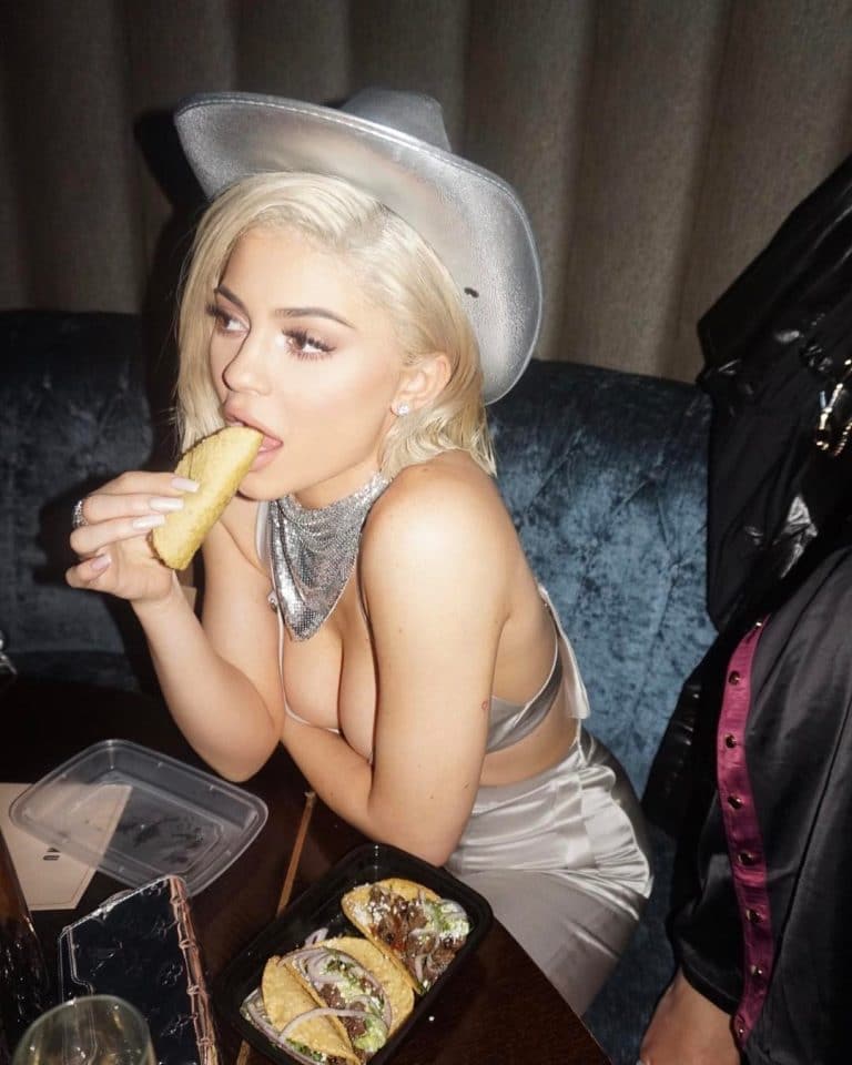 Kylie Jenner eating a taco and looking sexy in hat