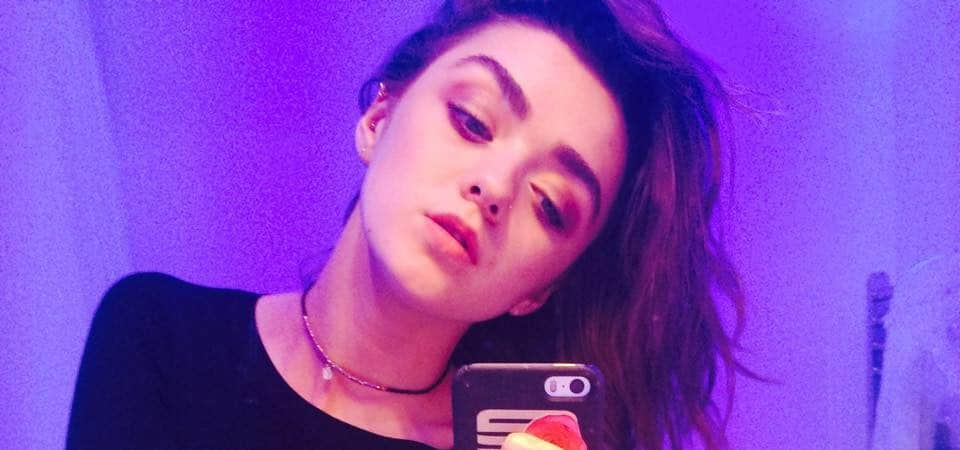 Maisie Williams bathroom selife with purple lighting