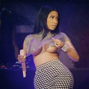 Nicki Minaj showing some under boobs at concert wearing a mesh shirt