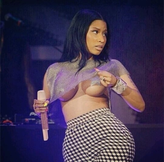 Nicki Minaj showing some under boobs at concert wearing a mesh shirt