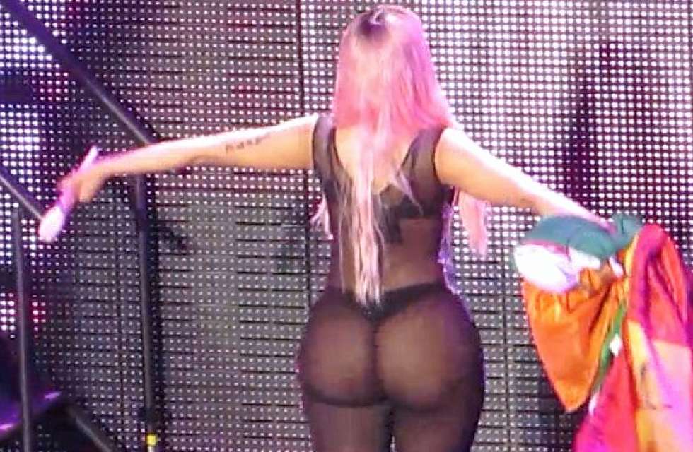 Nicki Minaj shows off her booty cheeks in see through outfit during show