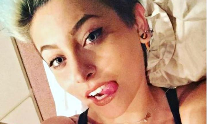 Paris Jackson taking a selfie in bed sticking her tongue out