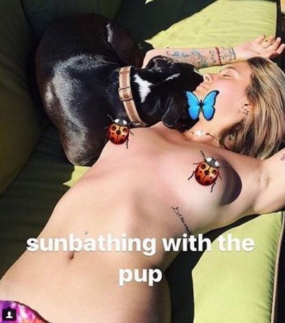 Paris Jackson topless in the sun with dog