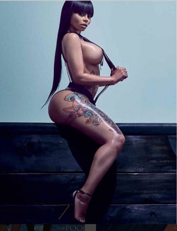 Blac Chyna straddeling a wall naked