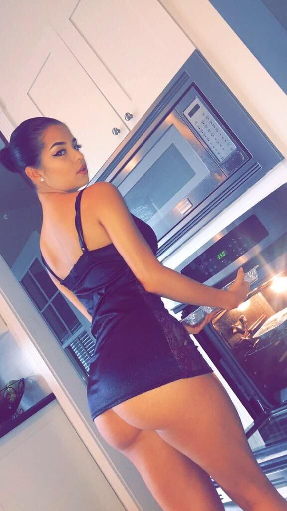 Demi Rose in the kitchen ass hanging out of dress