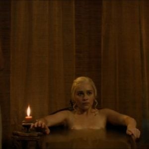Emilia Clarke in a bathtub boobs above water