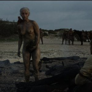 Emilia Clarke standing in the nude covered in ash