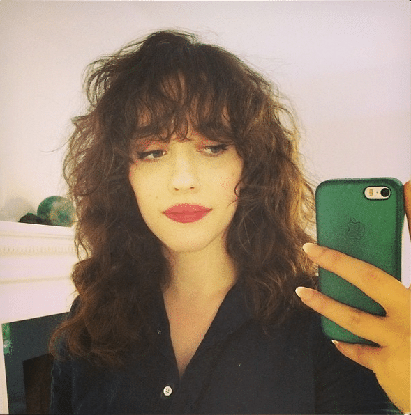 Kat Dennings with bangs and curly hair