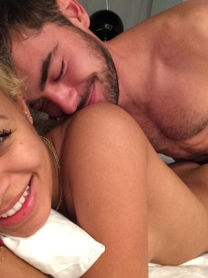 Sami Miro laying underneath Zac Efron.