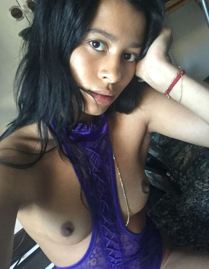 Sami Miro wearing a purple shirt tits hanging out