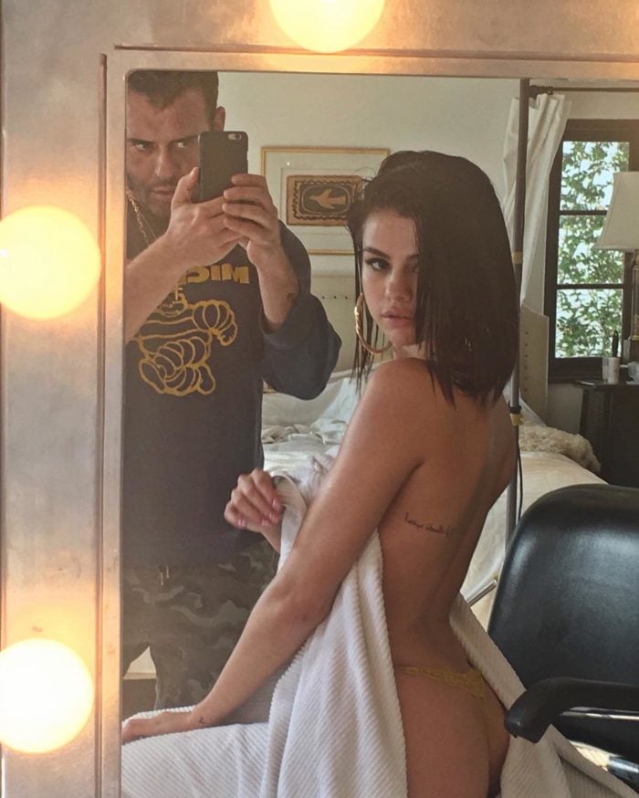 Selena Gomez hoop earrings on and showing her bare bottom