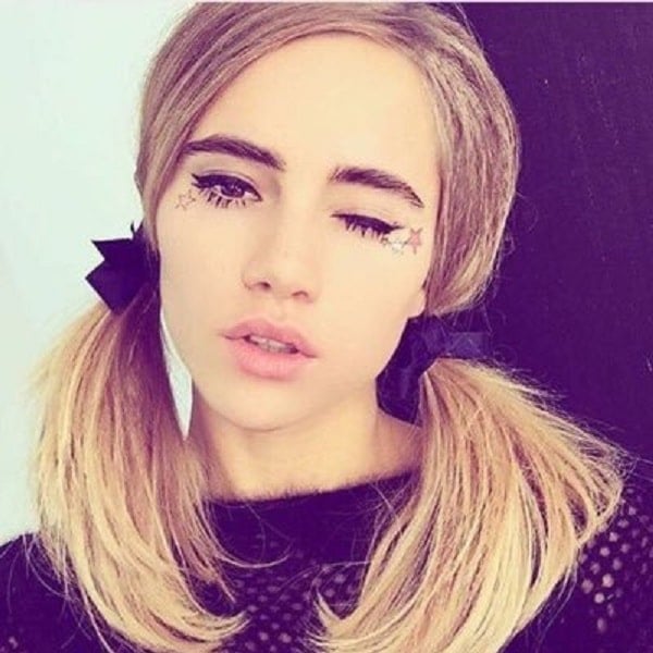 Suki Waterhouse selfie with pig tails and winking
