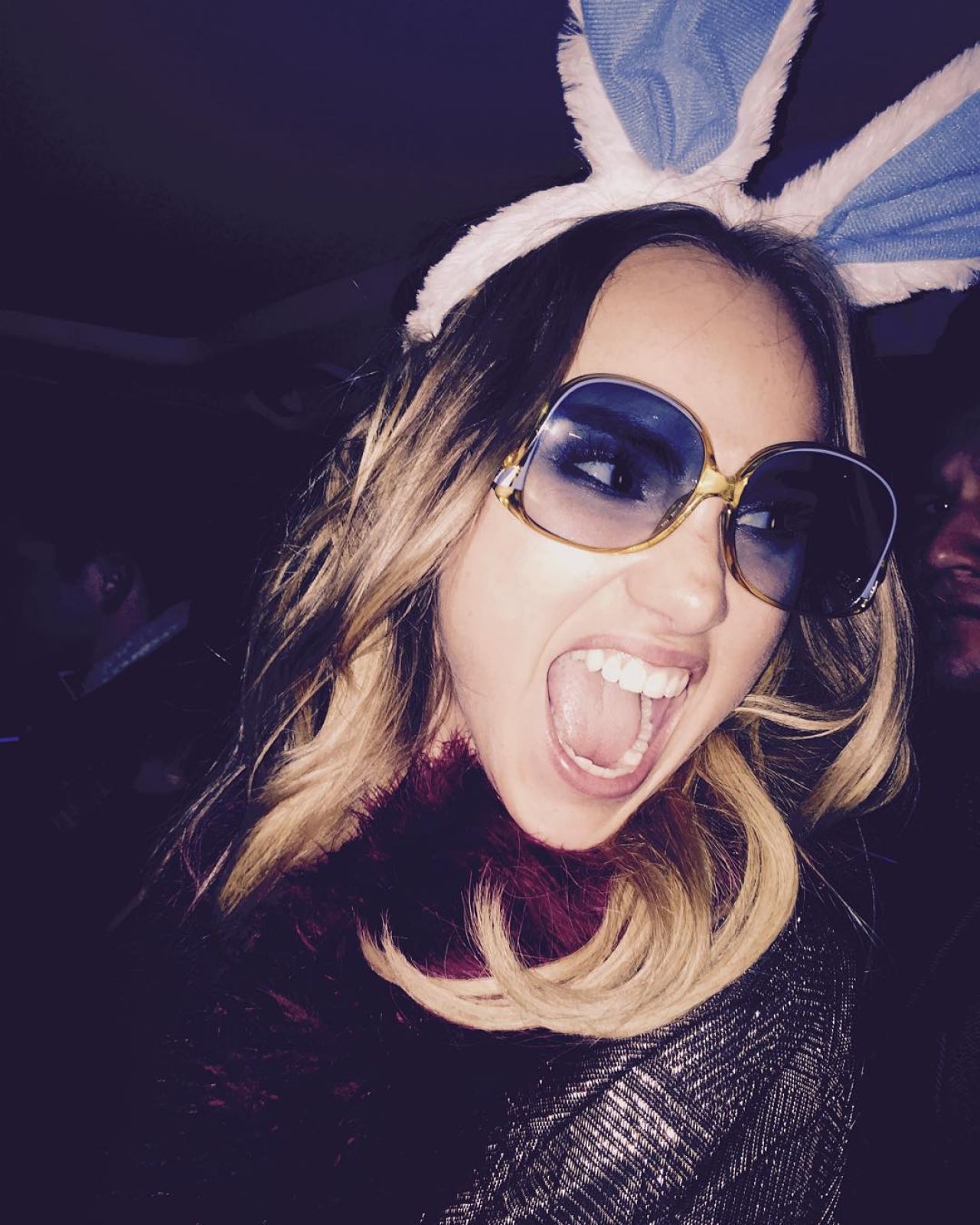 Suki Waterhouse with mouth open and bunny ears