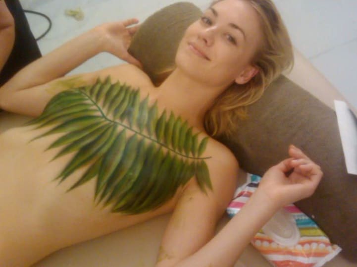 Yvonne Strahovski laying down with body paint on chest