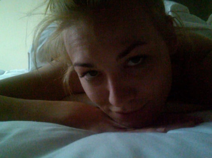 Yvonne Strahovski laying on bed taking a selfie