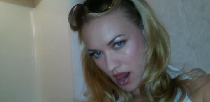 Yvonne Strahovski taking a selfie with her mouth open and sunglasses in hair