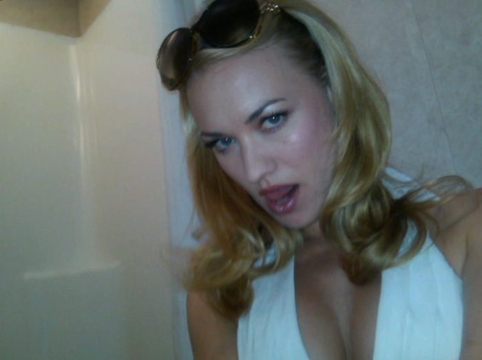 Yvonne Strahovski taking a selfie with her sunglasses in hair