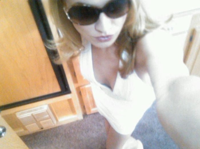 Yvonne Strahovski wearing sunglasses and white top