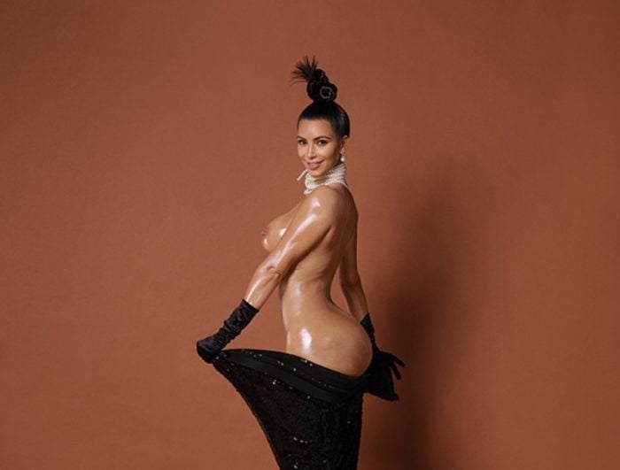Kim Kardashian undressed for paper magazine with black gloves on