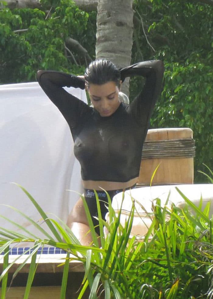 Kim Kardashian's tits showing through black top