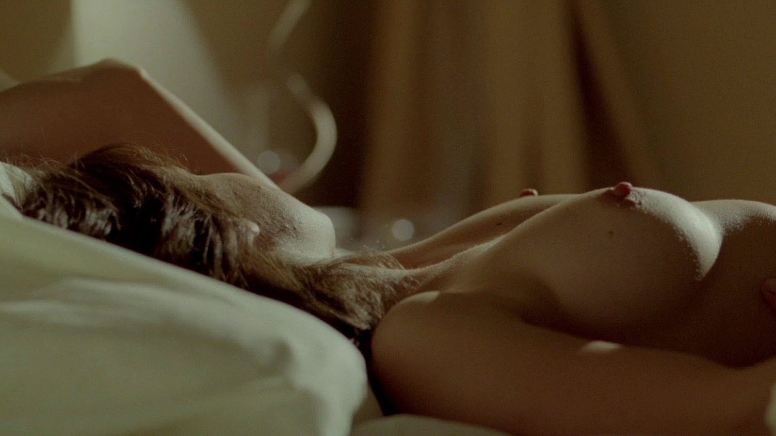 Melissa Benoist lying naked on bed