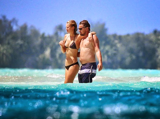 Toni Garrn and Leo at the beach in bathing suits