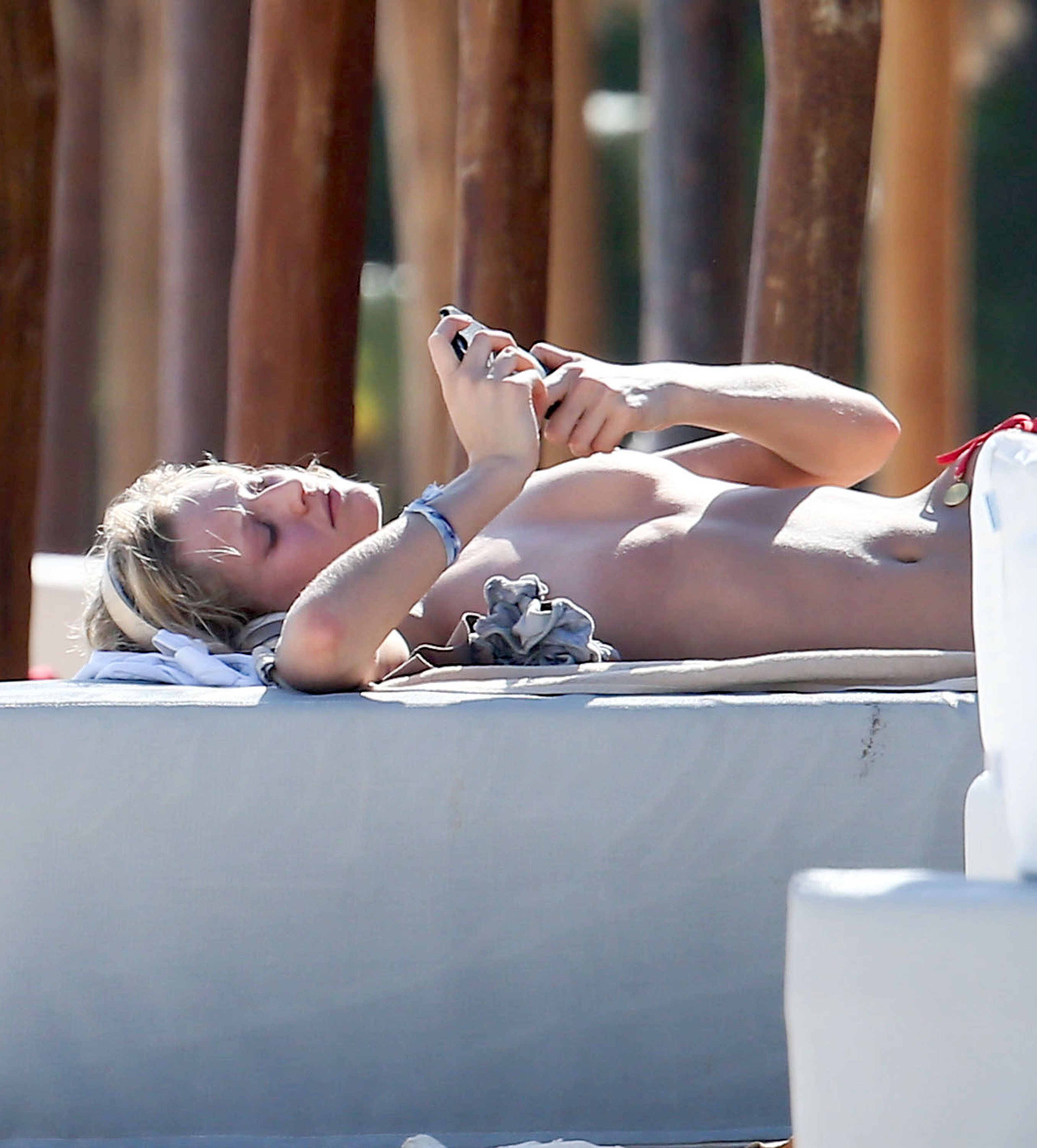Toni Garrn in Tulum sunbathing without her top on (3)