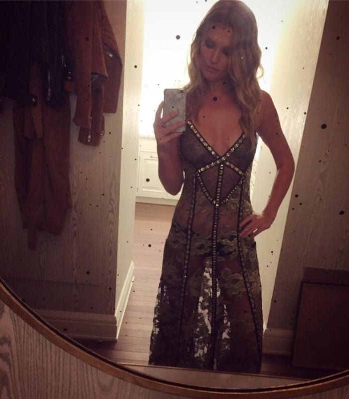 Toni Garrn in see through dress taking a selfie